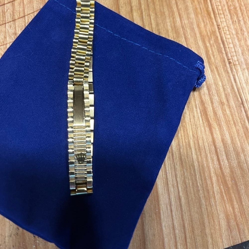 gold bracelet within crown on it. It is NOT a …. But your friends won’t know
